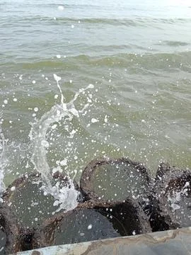Splash of water on the beach Stock Photos