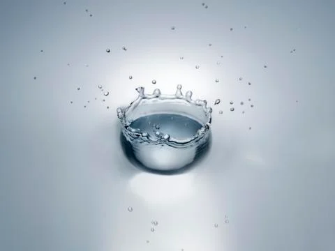 Splash in water creating crown shape Stock Photos