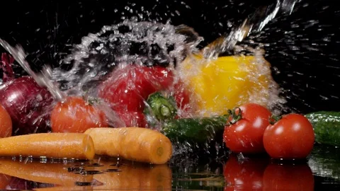 Splash of water falling down on vegetables in slow motion 動画素材 89340833