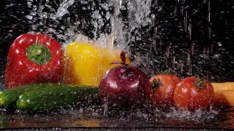 Splash of water falling down on vegetables in slow motion 動画素材 89341735