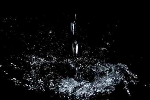 Splash of water. Isolate on black background Stock Photos