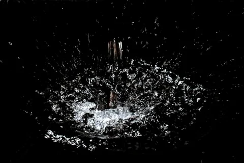 Splash of water. Isolate on black background Stock Photos