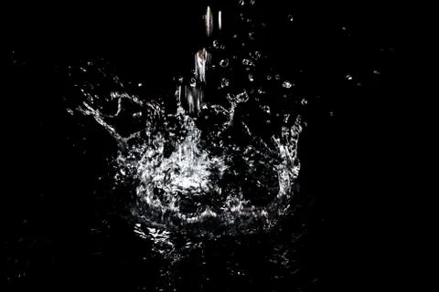 Splash of water. Isolate on black background Stock Photos