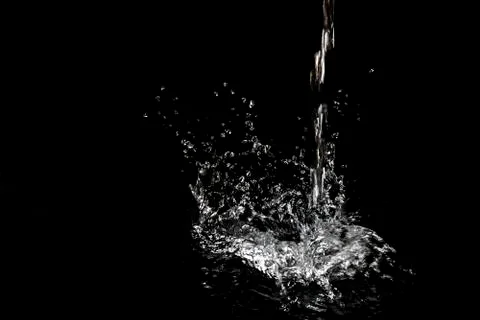 Splash of water. Isolate on black background Stock Photos