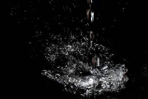 Splash of water. Isolate on black background Stock Photos