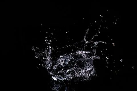 Splash of water. Isolate on black background Stock Photos