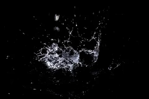 Splash of water. Isolate on black background Stock Photos