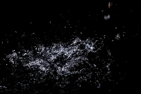 Splash of water. Isolate on black background Stock Photos