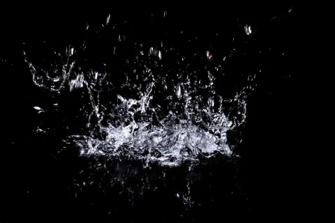 Splash of water. Isolate on black background Stock Photos