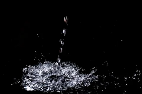 Splash of water. Isolate on black background Stock Photos