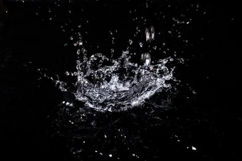 Splash of water. Isolate on black background Stock Photos