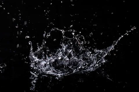 Splash of water. Isolate on black background Stock Photos