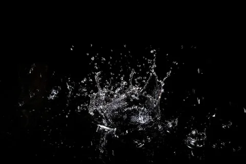 Splash of water. Isolate on black background Stock Photos