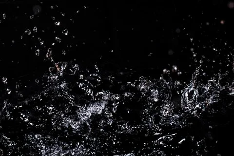 Splash of water. Isolate on black background Stock Photos