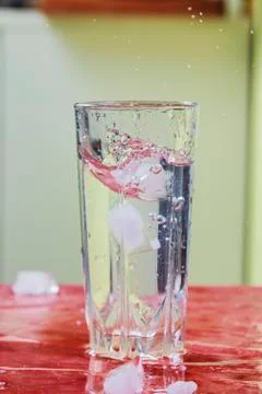 Splash of water in kitchen glass Stock Photos