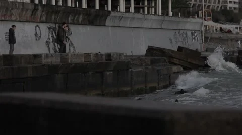 Splash of waves on the pier against the sun. Stock Footage 51929495