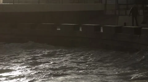 Splash of waves on the pier against the sun. Stock Footage 51929520