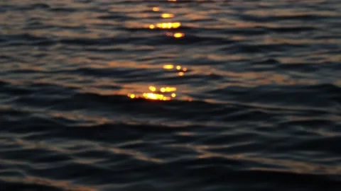 The splash of the waves in the setting sun. Video stock 233578196