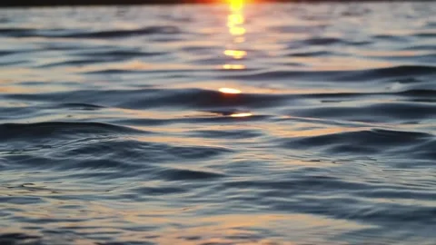 The splash of the waves in the setting sun. Video stock 233578229
