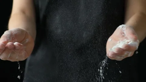 Splash of wheat flour, cook working with dough, hands close-up, slow motion Video stock 288315344