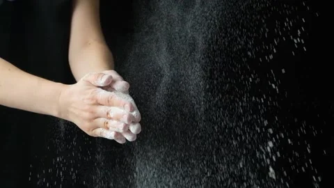 Splash of wheat flour, cook working with dough, hands close-up, slow motion Video stock 293465879