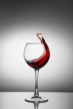 Splash of wine in a glass Stock Photos