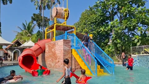 The Splash Zone and Water Slides on a Sunny Day at Pulo Saiji Water Adventure Stock Footage 282419375