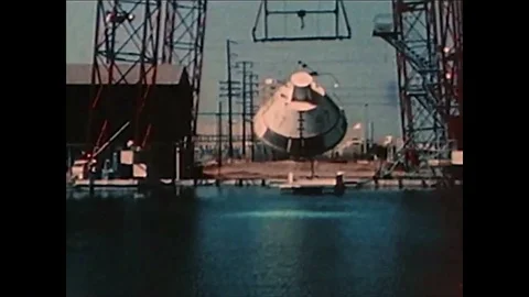 Splashdown tests for the Apollo spacecraft at an outdoor pool and a riding bag Video stock 86137942