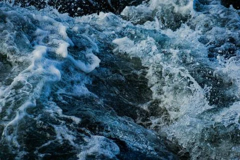 Splashes and blue waves Stock Photos