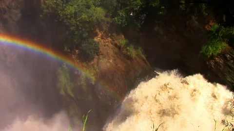 Splashes are turned into droplets and form a colorful beautiful rainbow Stock Footage 106050868