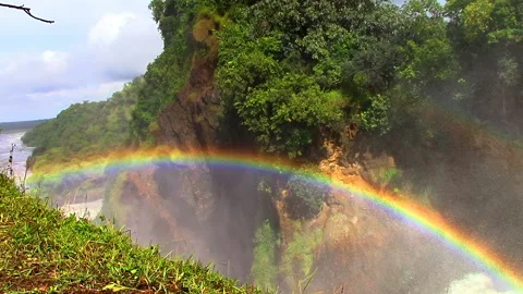 Splashes are turned into droplets and form a colorful beautiful rainbow Stock Footage 106051170