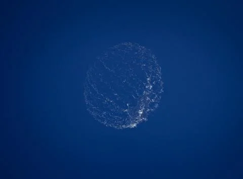 Splashes from a bursting large soap bubble Stock Photos