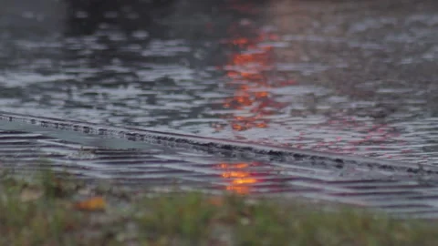Splashes from car wheels on the road while driving through puddles in the city Stock Footage 300863629