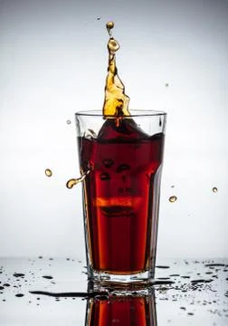Splashes of drink from a glass Stock Photos