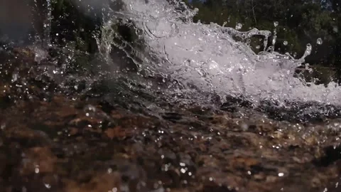 Splashes of fresh water close-up, low angle shot, waterfall on a mountain r.. Stock Footage 250620085