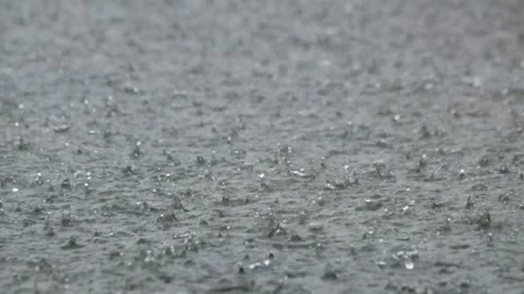 Splashes of heavy rainwater falling on the concrete floor Stock-Footage 291531151