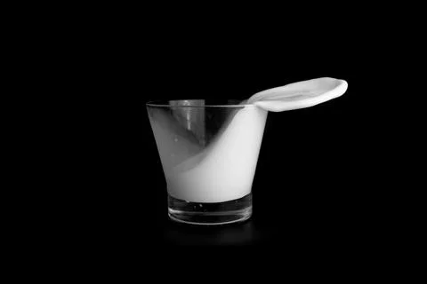 Splashes of milk on a black background Stock Photos