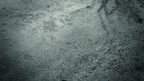 Splashes of rain hit the ground, drizzling rain 動画素材 201211009