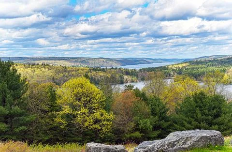 Splashes of sun shine  dot the landscape of the quabbin Stock Photos