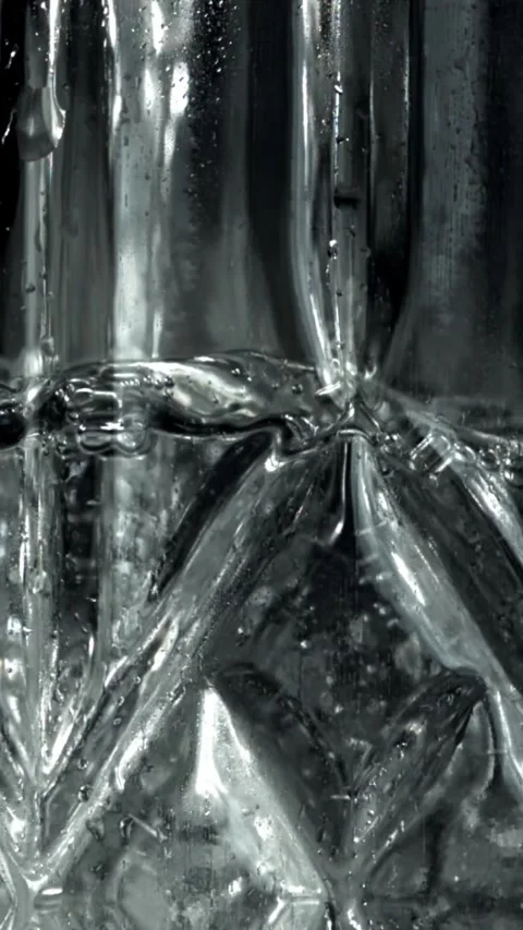 Splashes of vodka in a decanter. Filmed on a high-speed camera at 1000 fps Stock Footage 335366007