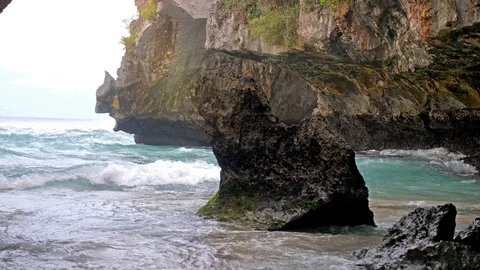 The splashes of water on the cave wall in ocean marble cave. slow motion Stock Footage 92780864
