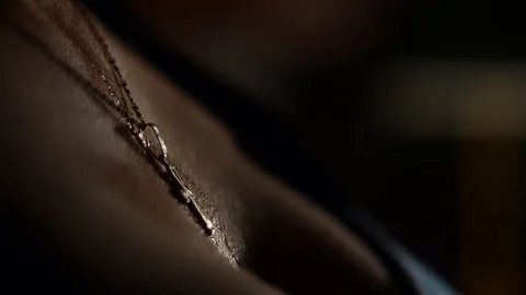 Splashes of water falling on her breasts, covered by a black blouse Video stock 96709084