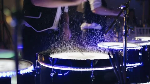Splashes of water fly up from the blows on the wet drum Видео 191934914