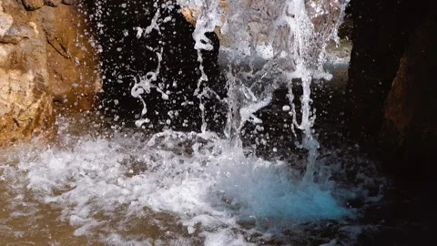 Splashes of water scatter to the sides. waterfall with grotto 動画素材 271199174