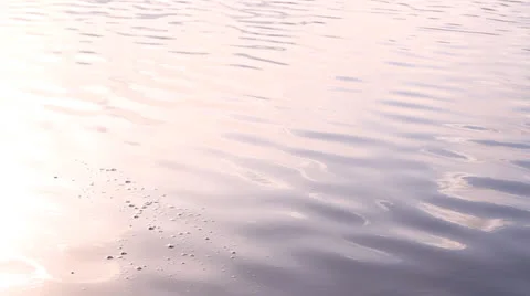 Splashes on water from a stone 库存影片 22910611