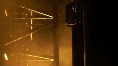 Splashes of water used to extinguish a fire and water flowing down metal Stock Footage 139791821