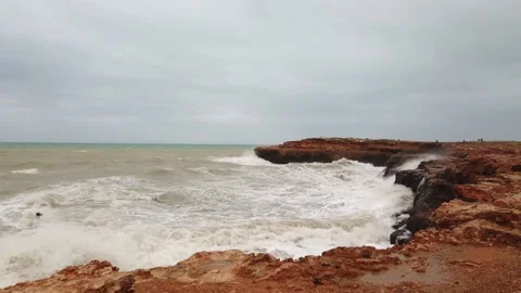 Splashes of water from the waves breaking on the stones, Storm Sea with waves Stock Footage 133806364