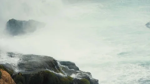 The splashes of the waterfall falling on rocks 動画素材 79098154