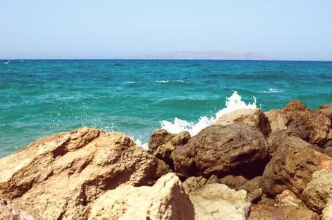 Splashes from the waves bumping against the rocky shore Photos