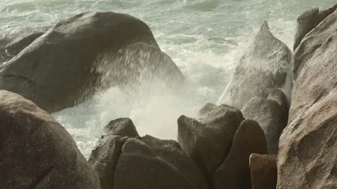 Splashes of waves hitting coastal rocks Stock Footage 331550735